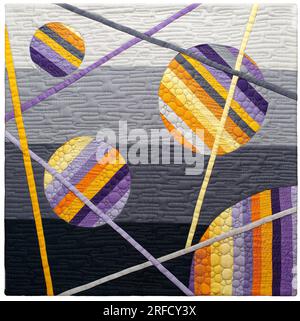 Mini quilt with orange-purple circles and intersecting lines on gray-black background Stock Photo