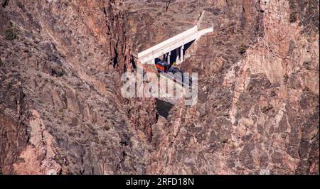 Royal Gorge Route Railroad, a heritage railroad, viewed from the Royal Gorge Suspension Bridge. This vintage train provides a two hour ride. Stock Photo