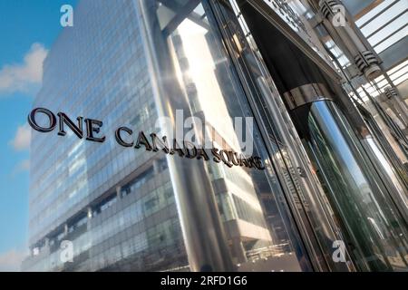 One Canada Square entrance name signage outside the iconic tower One Canada Square in sun outdoors exterior sign name in Canary Wharf London E14 Stock Photo