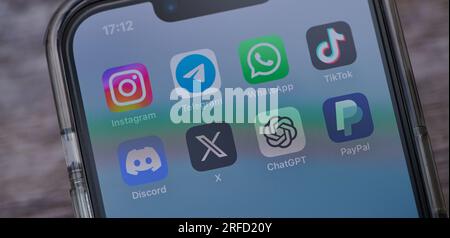 Mainz, Germany - August 02, 2023: icons of apps like instagram, telegram, tiktok, twitter, discord on a German smartphone Stock Photo