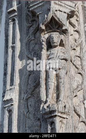 Wood carving on the outside of Lavenham Guildhall a magnificent medieval timber framed building in the Suffolk village of Lavenham, Sudbury, Suffolk Stock Photo