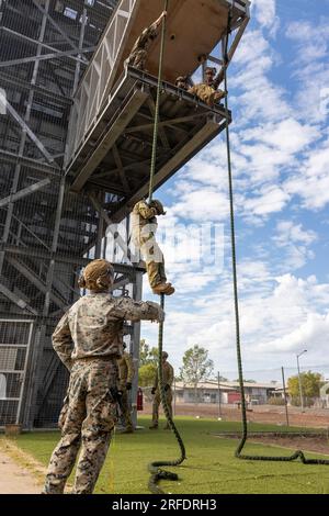 U.S. Marines with Lima Co., 3rd Battalion, 1st Marine Regiment (Reinforced), Marine Rotational Force – Darwin 23 and Australian Army Soldiers with 5th Battalion, Royal Australian Regiment, 1st Brigade practice fast-roping at Robertson Barracks, Northern Territory, Australia, July 27, 2023. Through increased training and exercises, MRF-D and the Australian Defence Force are expanding their range of interoperability, further strengthening the Alliance between forces. (U.S. Marine Corps photo by Staff Sgt. Scott Smolinski) Stock Photo