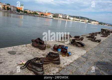 The memorial Shoes on the Danube Bank, is a monument to the Hungarian Jews who were persecuted and killed during World War 2. Pest, Budapest, Hungary. Stock Photo