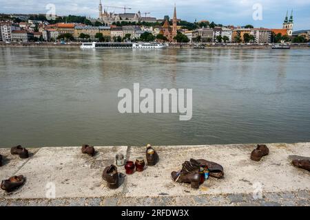 The memorial Shoes on the Danube Bank, is a monument to the Hungarian Jews who were persecuted and killed during World War 2. Pest, Budapest, Hungary. Stock Photo