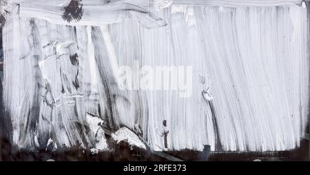 greenhouse window with whitewashed glass. rough paintbrush strokes on glass surface. Stock Photo