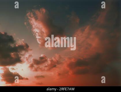 cloudy sunset sky The beauty of orange and pink clouds at dusk. Stock Photo