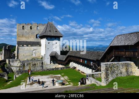 Celje, Slovenia - September 18 2022: View of Celje castle and hills in Stajerska, Slovenia with a group of people in the courtyard Stock Photo