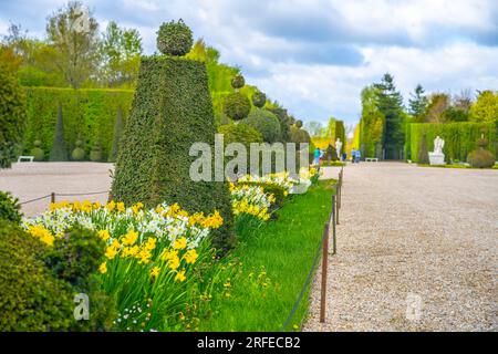 Trimmed trees and flower beds in the Gardens of Versailles, Chateau Versailles near Paris, France. Stock Photo