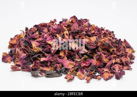 Pile of of Dried Rose Petals on a white surface Stock Photo