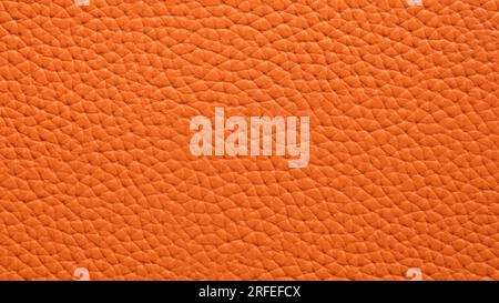 Texture of orange natural or artificial leather closeup Stock Photo