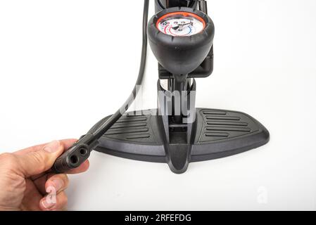 Bicycle and car hand pump on a white Stock Photo