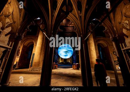 Southwell, UK. 2nd Aug 2023. Luke Jerram's 'Gaia' installation suspended from the ceiling of Southwell Minster.  The seven-metre diameter rotating Gaia features high resolution NASA imagery of the earth's surface. Credit: Neil Squires/Alamy Live News Stock Photo