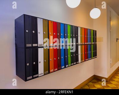 Group of colorful mail boxes in Spanish apartment's building Stock Photo
