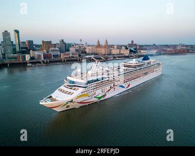 Norwegian Dawn cruise ship sails down the River Mersey, Liverpool, England Stock Photo