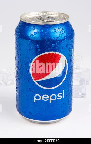 A can of Diet Pepsi on a light colored background with sunlight ...