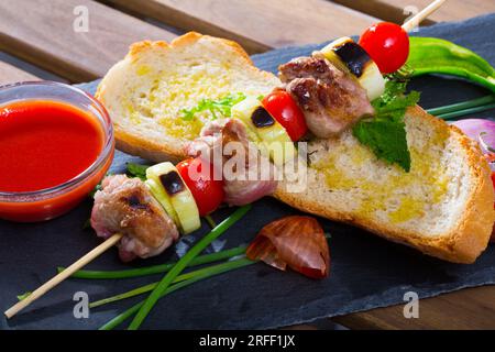 Shashlik (mutton slices on barbecue skewers) Stock Photo