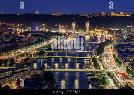 France, Seine-Maritime, Rouen, Armada 2023, Sainte-Catherine Hill Panorama, night view at blue hour of the Seine river valley, car traffic lights, downtown bridges and Gustave Flaubert Bridge Stock Photo