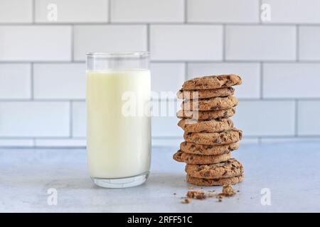 A glass of milk with chocolate chip cookies Stock Photo