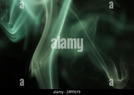 Green smoke on a dark background, patterns Stock Photo