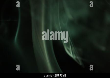Green smoke on a dark background, patterns Stock Photo