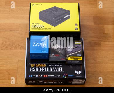 Tambov, Russian Federation - April 07, 2022 Boxes with brand new components in them - Asus TUF Gaming motherboard, Intel Core i5 11400 CPU, Corsair DD Stock Photo