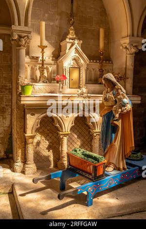 Langrune-Sur-Mer, France - 07 18 2023: View of the statue of the virgin mary inside the St. Martin's Church Stock Photo