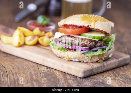 Homemade Burger On Dark Wood Stock Photo