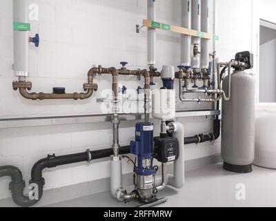 sanitary distribution battery, pressure increase and water softening