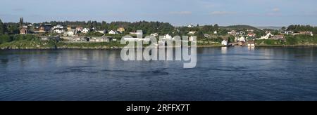 Houses along the waterfront on Karmoy island opposite Haugesund, Norway. Stock Photo