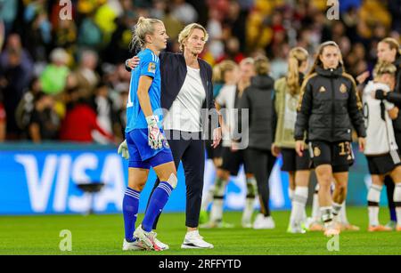 Coach Martina Voss-Tecklenburg of Germany comforts Merle Frohms (1) of Germany at full time during the 2023 FIFA Womenâ&#x80;&#x99;s World Cup, Group H football match between Korea Republic and Germany on 3 August 2023 at Brisbane Stadium in Brisbane, Australia Stock Photo