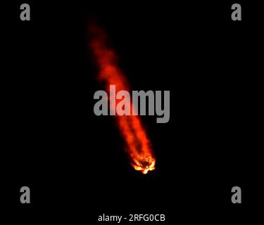 The exhaust plume of the SpaceX Falcon 9 rocket turns red as it launches the Galaxy 37 communications satellite for Intelsat at 1:00 AM from Launch Complex 40 at the Cape Canaveral Space Force Station, Florida on Thursday, August 3, 2023. Photo by Joe Marino/UPI Credit: UPI/Alamy Live News Stock Photo