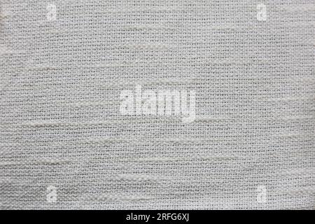 a close up of a cream colored plaid fabric Stock Photo