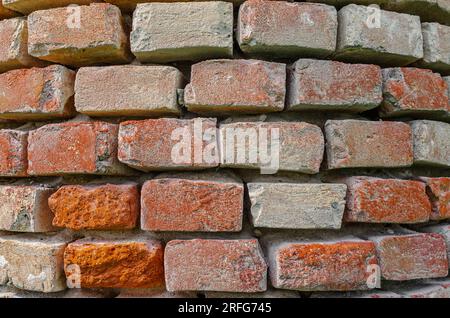 Old red brick column, weathering bricks. Stock Photo