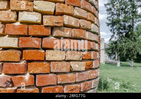 Old red brick column, weathering bricks. Stock Photo