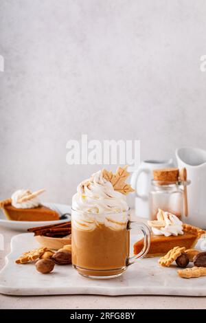 Autumn pumpkin spice latte with whipped cream and cinnamon on dark ...