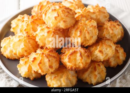 macarons sweet cookie with coconut closeup on the plate on the table. Horizontal Stock Photo