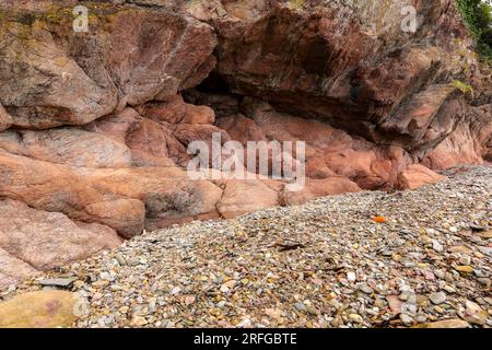 Red stones on the shore of the Atlantic Ocean Stock Photo