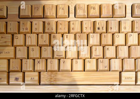 Closeup view on an old wooden computer keyboard - Vintage art and technology Stock Photo