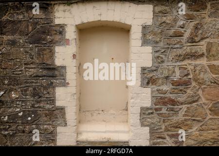 The window of an old, medieval house. View from outside. Stock Photo