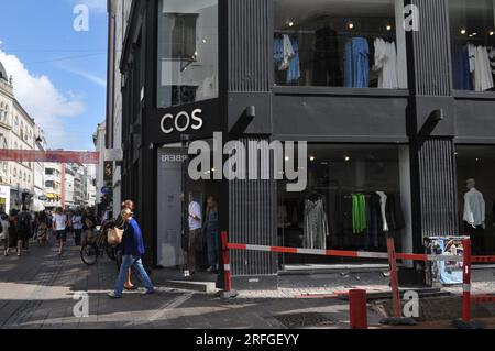 25 May 2023/ Consumers wait at Louis Vuitton store in danish capital  Copenhagen on stroeget pedestrain stree. (Photo.Francis Joseph Dean/Dean  Pictures Stock Photo - Alamy