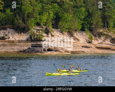 Kayakers in Pictured Rocks National Lakeshore on Lake Superior on the Upper Peninsula of Michigan USA Stock Photo