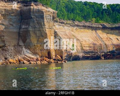 Kayakers in Pictured Rocks National Lakeshore on Lake Superior on the Upper Peninsula of Michigan USA Stock Photo