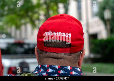 Washington, United States. 03rd Aug, 2023. A supporter of former President Donald Trump wears a 'Trump 2020' cap outside the E. Barrett Prettyman Federal Courthouse before his arraignment on charges of election subversion, in Washington DC, on Thursday, August 3, 2023. Special counsel Jack Smith has indicted the former president on four charges in connection with his actions leading up to and after the January 6 attack on the U.S. Capitol. Photo by Bonnie Cash/UPI Credit: UPI/Alamy Live News Stock Photo