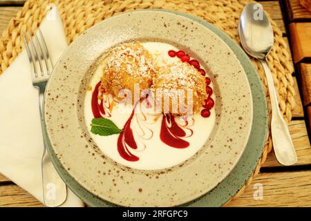 cottage cheese dumpling with breadcrumbs powdered sugar and fruits Stock Photo