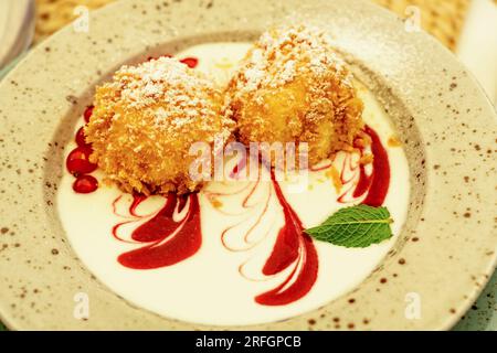 cottage cheese dumpling with breadcrumbs powdered sugar and fruits Stock Photo