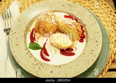 cottage cheese dumpling with breadcrumbs powdered sugar and fruits Stock Photo