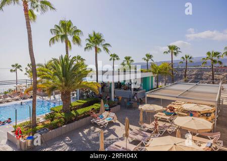 Beautiful view of outdoor pool area on palm trees and blue sky background. RIU Vistamar hotel,  Gran Canaria, Spain. Stock Photo