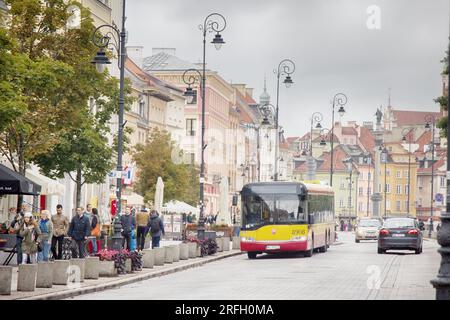 Warsaw, Poland - September 9, 2017: one of the main streets of the old city in a beautiful background of houses in a classic style. Urban transport, c Stock Photo