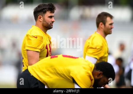 Washington Commanders quarterback Sam Howell (14) warms up prior