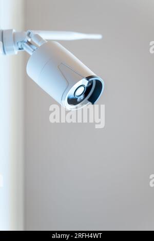 Security camera for home surveillance with wifi antenna to connect to alarm center Stock Photo